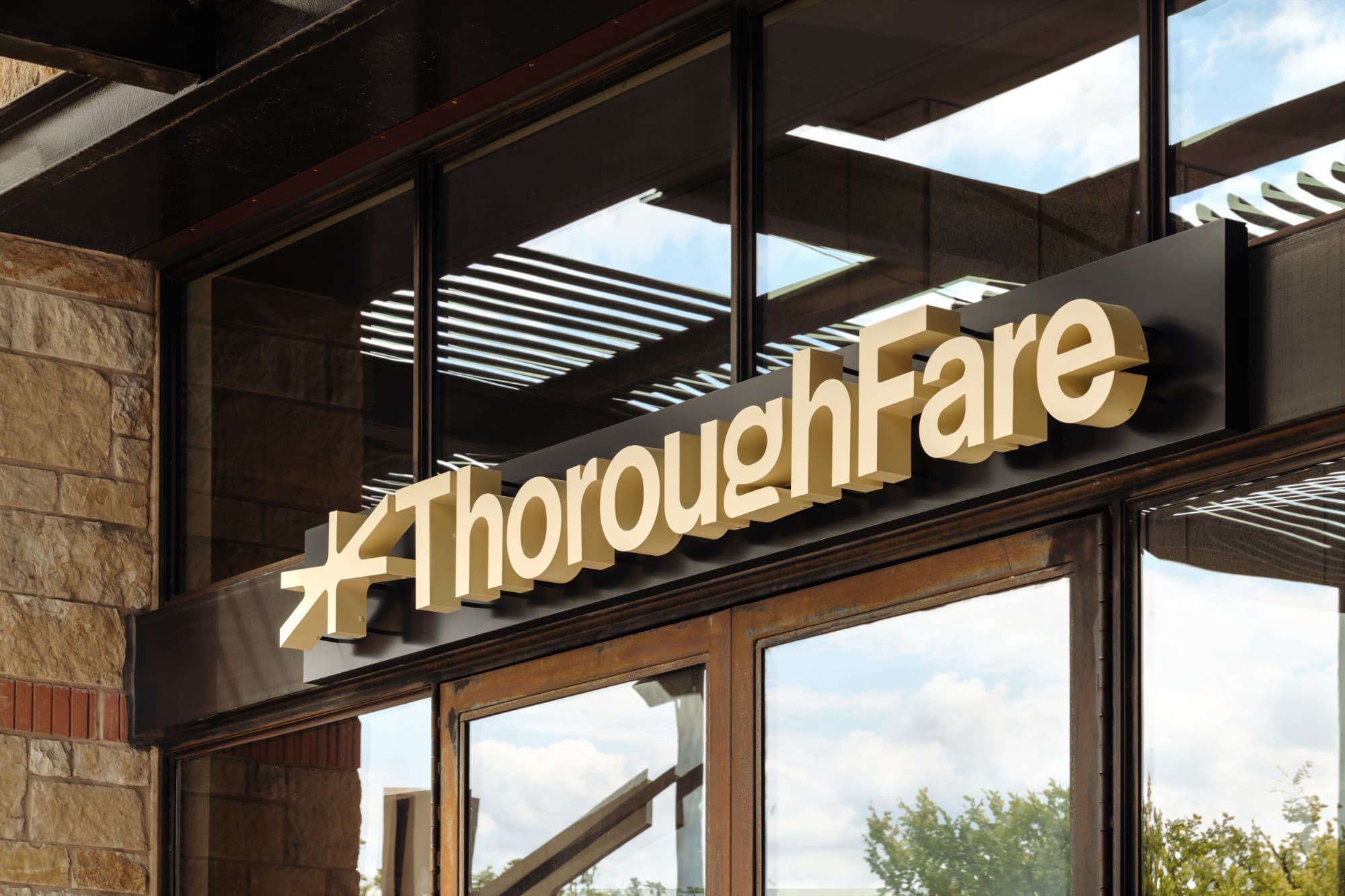 The ThoroughFare sign above the Mueller storefront